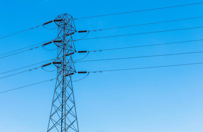 High power transmission line against a blue sky